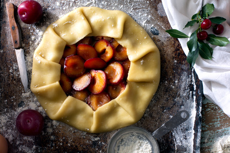 Traditional rustic cake prepared from dough and plum. Ready to be preparedの写真素材