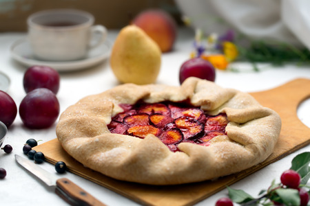 Traditional rustic cake prepared from dough and plum. Morning tea time. Still lifeの写真素材