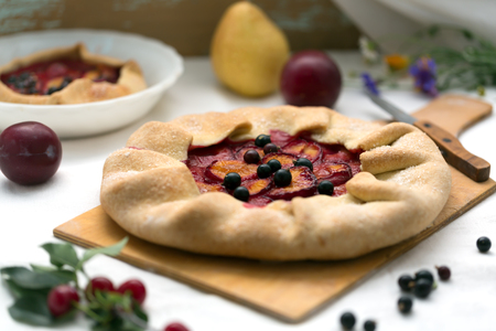 Delicious rustic cake prepared from dough and fruits.の写真素材