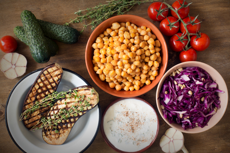 Fresh organic vegetables on wooden rustic background top view.の写真素材