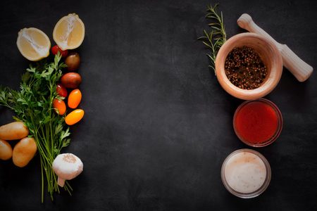 Mediterranean food vegetables and sauces on the chalkboard. Top viewの写真素材