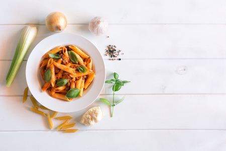 Italian Penne pasta with Bolognese sauce top viewの写真素材