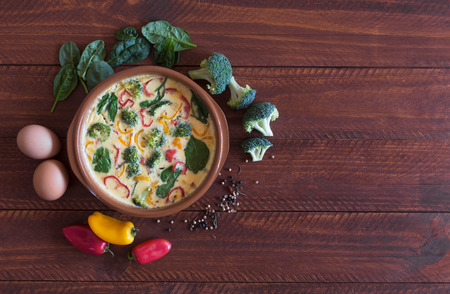 Fresh omelette prepared with vegetables and spinach. Top viewの写真素材