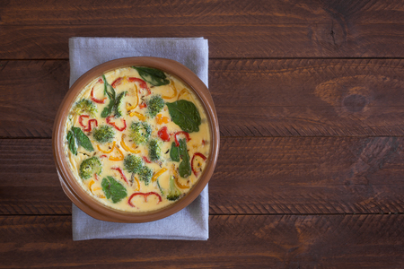 Fresh omelette prepared with vegetables and spinach. Top viewの写真素材