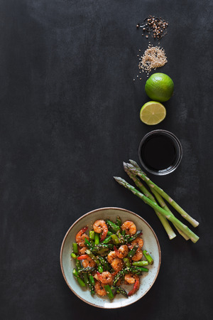 Salad with asparagus and shrimps in plateの写真素材