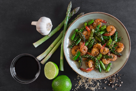 Salad with asparagus and shrimps in plateの写真素材