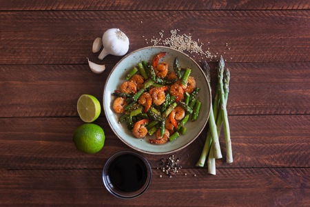 Salad with asparagus and shrimps in plateの写真素材