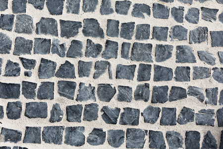 Gray square stones paved roadの写真素材