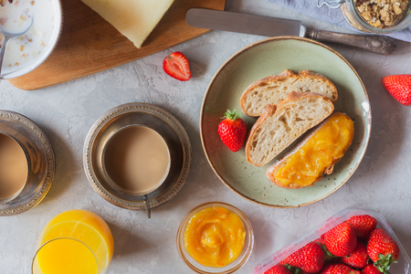 Traditional european breakfast. Bread, jam and berries on the white backgroundの写真素材