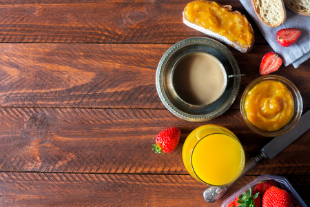 Traditional european breakfast. Bread, jam and berries.Coffee with milkの写真素材