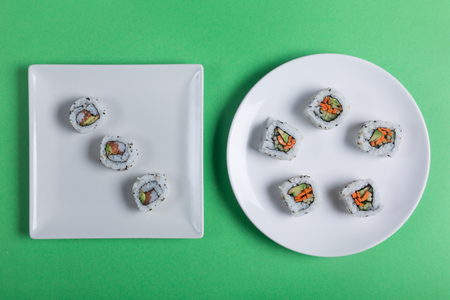 Japanese sushi on a green background. Top viewの写真素材