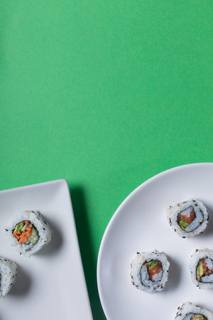 Japanese sushi on a green background. Top view with copy spaceの写真素材