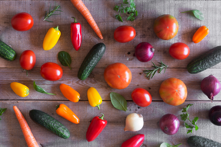 Fresh organic vegetables on a wooden background. Top viewの写真素材