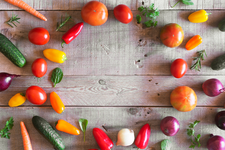 Fresh organic vegetables on a wooden background. Top viewの写真素材