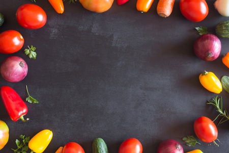 Fresh organic vegetables on a dark background. Top viewの写真素材
