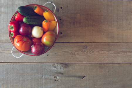 Fresh organic vegetables on a wooden background. Top viewの写真素材