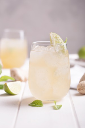 Fresh cocktail prepared with ginger beer, lime and iceの写真素材