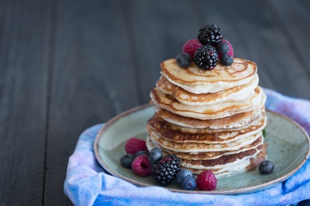Pancakes with berries and honeyの写真素材