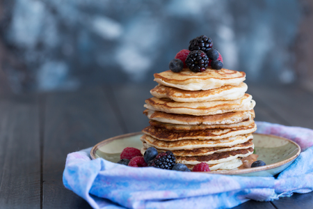Pancakes with berries and honeyの写真素材