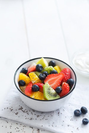fresh organic fruit salad with chia seeds on the white tableの写真素材