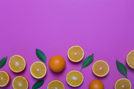 Fresh oranges on the purple backgroundの写真素材
