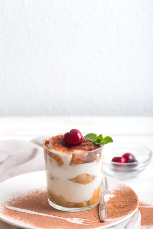 Tiramisu in a glass cup. Vertical orientationの写真素材
