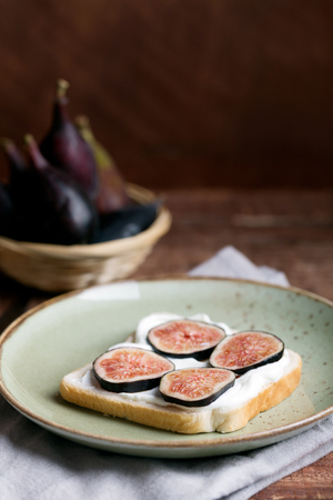 Sandwich with mascarpone and figs on the plate. Organic food for healthy lifeの写真素材