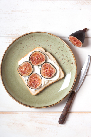Sandwich with mascarpone and figs on the plate. Organic foodの写真素材