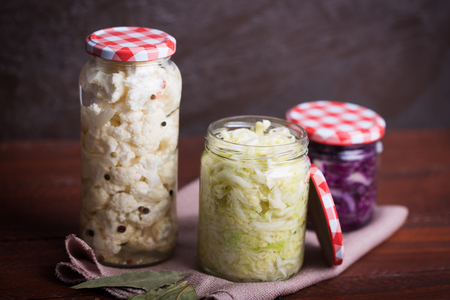 Sauerkraut in a blue bowl on a wooden tableの写真素材