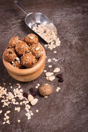 Healthy organic energy granola bolls with nuts, cacao, oats and raisinsの写真素材