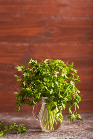 Fresh parsley leaves from the garden in the glassの写真素材