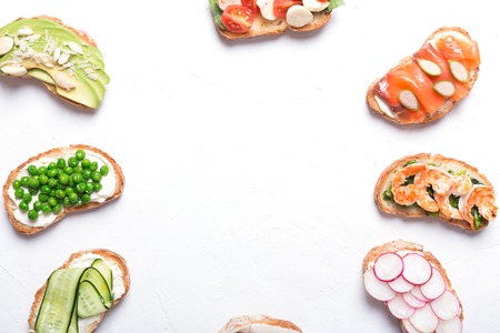 sandwiches or tapas prepared with bread and tasty ingredients. Could be nice food for healthy breakfast ot lunchの写真素材