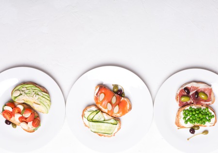 sandwiches or tapas prepared with bread and tasty ingredients. Could be nice food for healthy breakfast ot lunchの写真素材