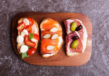 sandwiches or tapas prepared with bread and tasty ingredients. Could be nice food for healthy breakfast ot lunchの写真素材