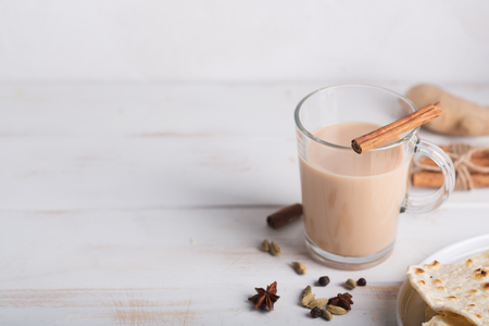 Flavoured tea chai made by brewing black tea with aromatic spices and herbs. Image with copy spaceの写真素材