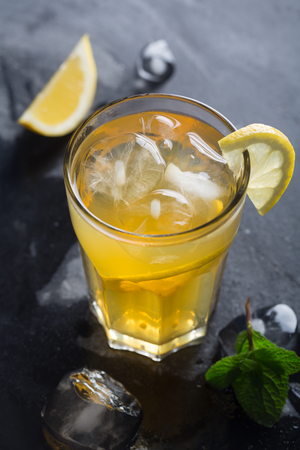 Glass of refreshing homemade lemonade with ice and mint. Vertical orientationの写真素材