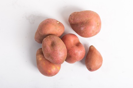 Trendy ugly organic natural potatoes on the table.の写真素材