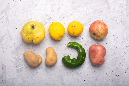 Trendy ugly organic fruits and vegetables on the table