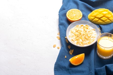 Breakfast which consist of different yellow ingredients - sereales and fruitsの写真素材