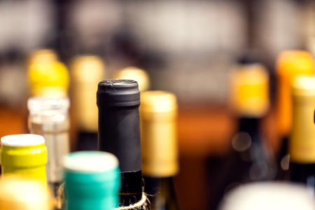 Bottles of wine on the shelves of an alcohol shop in Spain, Alicante. Background with copy spaceの写真素材