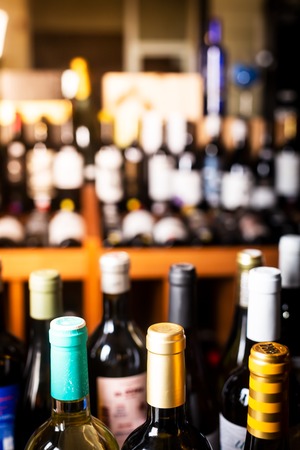 Bottles of wine on the shelves of an alcohol shop in Spain, Alicante. Backgroundの写真素材