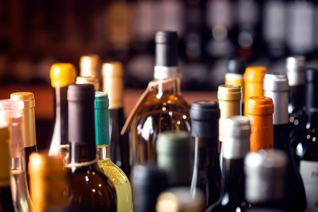 Bottles of wine on the shelves of an alcohol shop in Spain, Alicante. Background, horizontal orientation