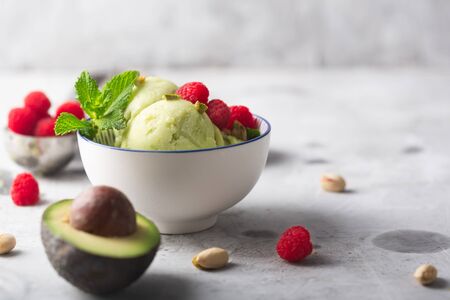 Homemade organic avocado ice cream in a bowl on gray backgroundの写真素材