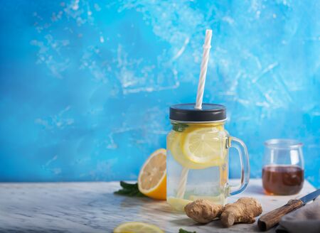 Ginger Water or tea in Glass jar With Lemon and Honey. This Drink is a Natural Anti-Inflammatory Agent That Acts as an Antioxidant and Improves Blood Sugarの写真素材