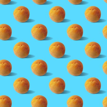 Seamless pattern with fresh peach on a blue background. Stylish concept