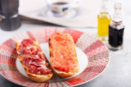Spanish tomato and jamon toast close up, traditional breakfast or lunchの写真素材