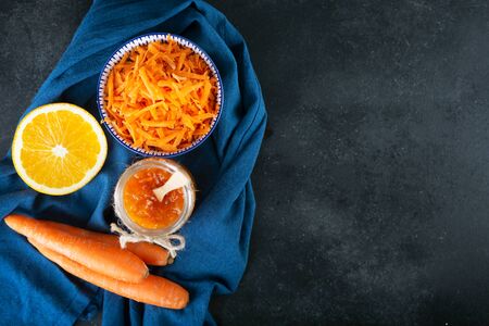 Carrot Jam with orange juice on a black background, copy spaceの写真素材