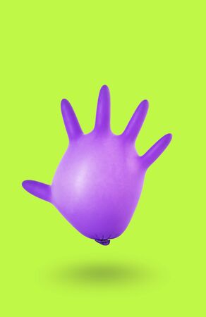 Mask on the medical glove as a symbol of protectionの写真素材