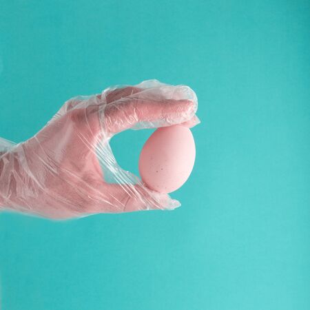 Easter in gloves. Eggs in protective gloves. Coronavirus, Quarantine, Pandemic