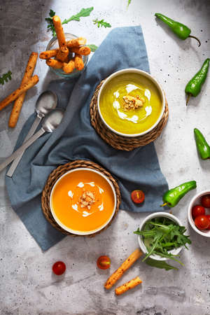 Cream of pumpkin and vegetables soup with sour cream sauce, flat layの写真素材